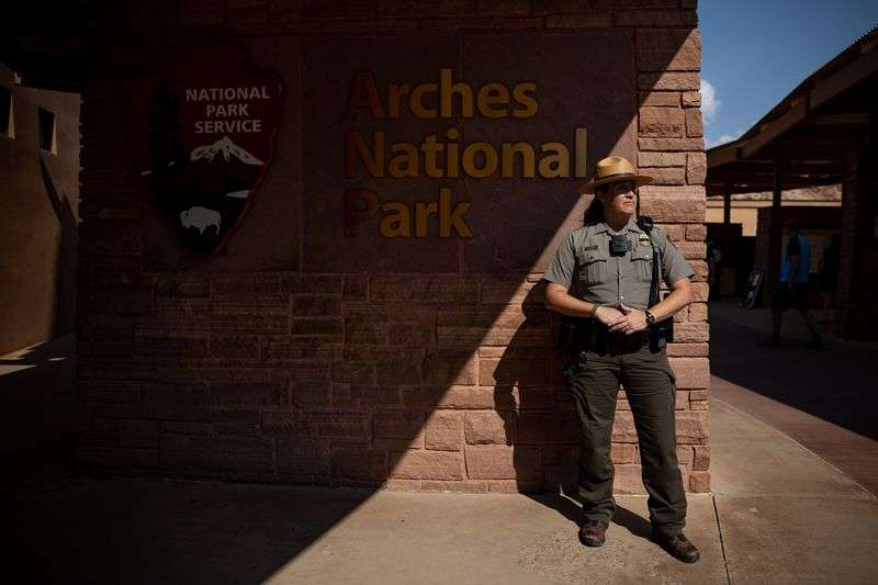 National Park Service ranger Melissa Hulls, the visitor
and resource protection supervisor for Arches National Park, poses
for a photo outside of the park’s visitors center on Sunday, Sept.
19, 2021.