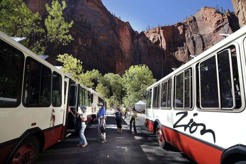Visitors board a shuttle at Zion National Park on
Wednesday, Oct. 14, 2020.