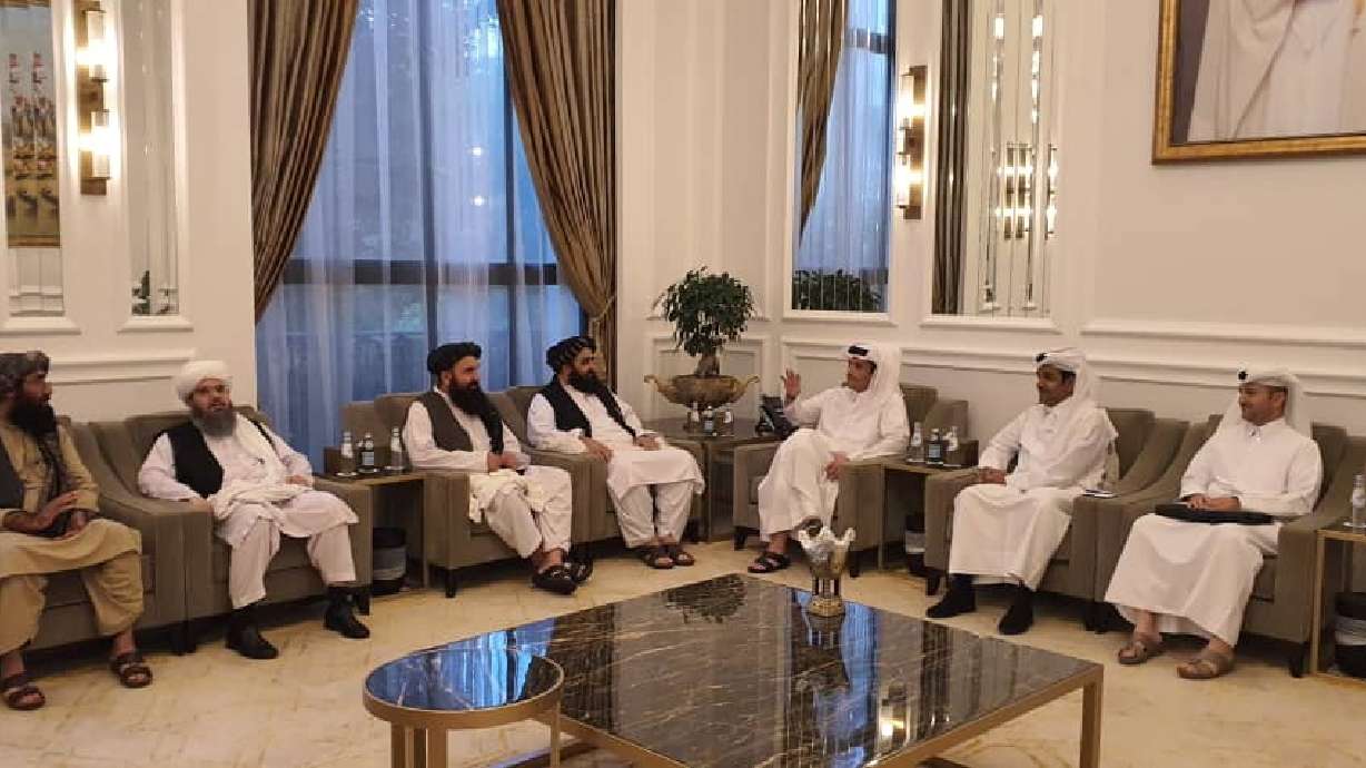 Taliban delegates meet with Qatar delegates in Doha, Qatar, in this handout photo uploaded to social media on Saturday.