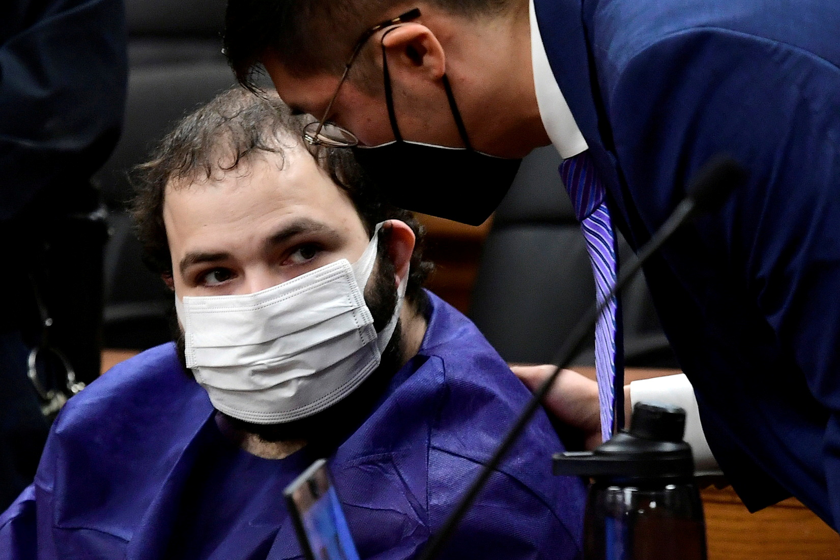 King Soopers shooting suspect Ahmad Al Aliwi Alissa, 21, appears before Boulder District Court Judge Thomas Mulvahill at the Boulder County Justice Center in Boulder, Colorado, March 25. Psychologists who evaluated a 22-year-old man accused of fatally shooting 10 people at a Colorado grocery store in March have found him incompetent to stand trial.
