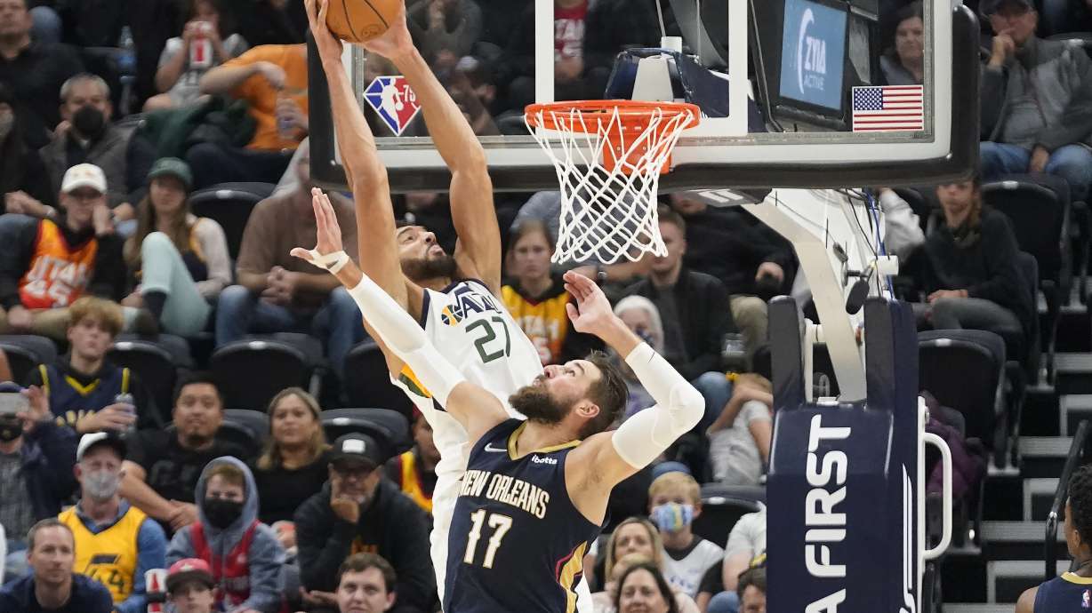 Utah Jazz center Rudy Gobert (27) dunks against New Orleans Pelicans' Jonas Valanciunas in the first half of a preseason NBA basketball game Monday, Oct. 11, 2021, in Salt Lake City.