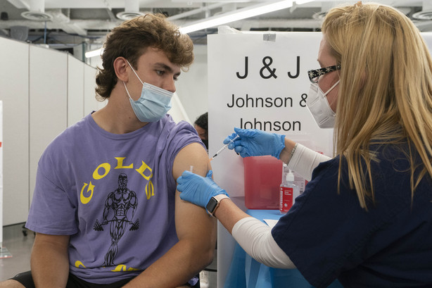 Bradley Sharp, of Saratoga, New York, gets the Johnson & Johnson vaccine from registered nurse Stephanie Wagner in New York on July 30. Starting Thursday, the Food and Drug Administration convenes its independent advisers for the first stage in the process of deciding whether extra shots of Moderna or Johnson & Johnson vaccines should be dispensed and, if so, who should get them and when.