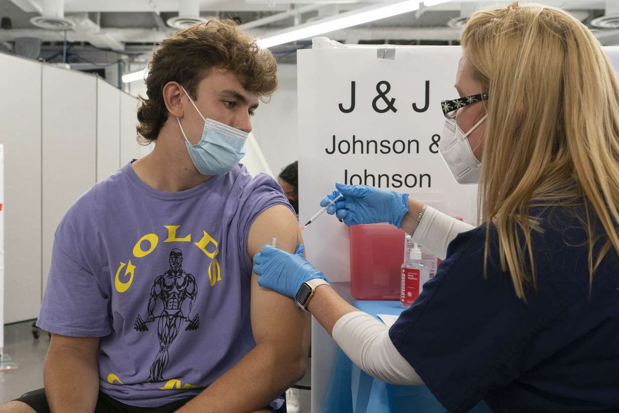 Bradley Sharp, of Saratoga, New York, gets the Johnson & Johnson vaccine from registered nurse Stephanie Wagner in New York on July 30. Starting Thursday, the Food and Drug Administration convenes its independent advisers for the first stage in the process of deciding whether extra shots of Moderna or Johnson & Johnson vaccines should be dispensed and, if so, who should get them and when.