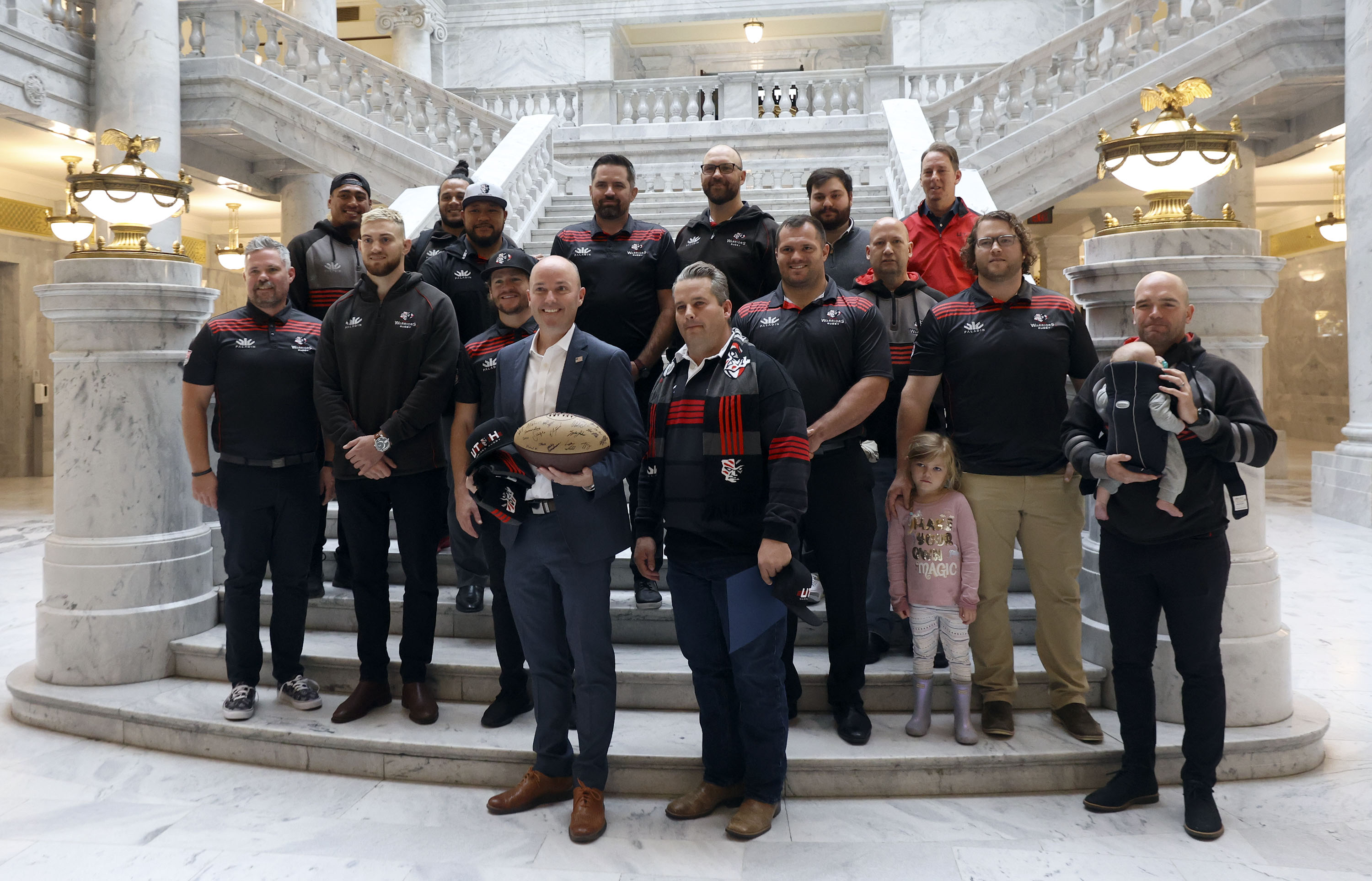 Utah Gov. Spencer Cox poses for a photo with the Utah Warriors professional rugby team at the Capitol in Salt Lake City on Tuesday, Oct. 12, 2021.