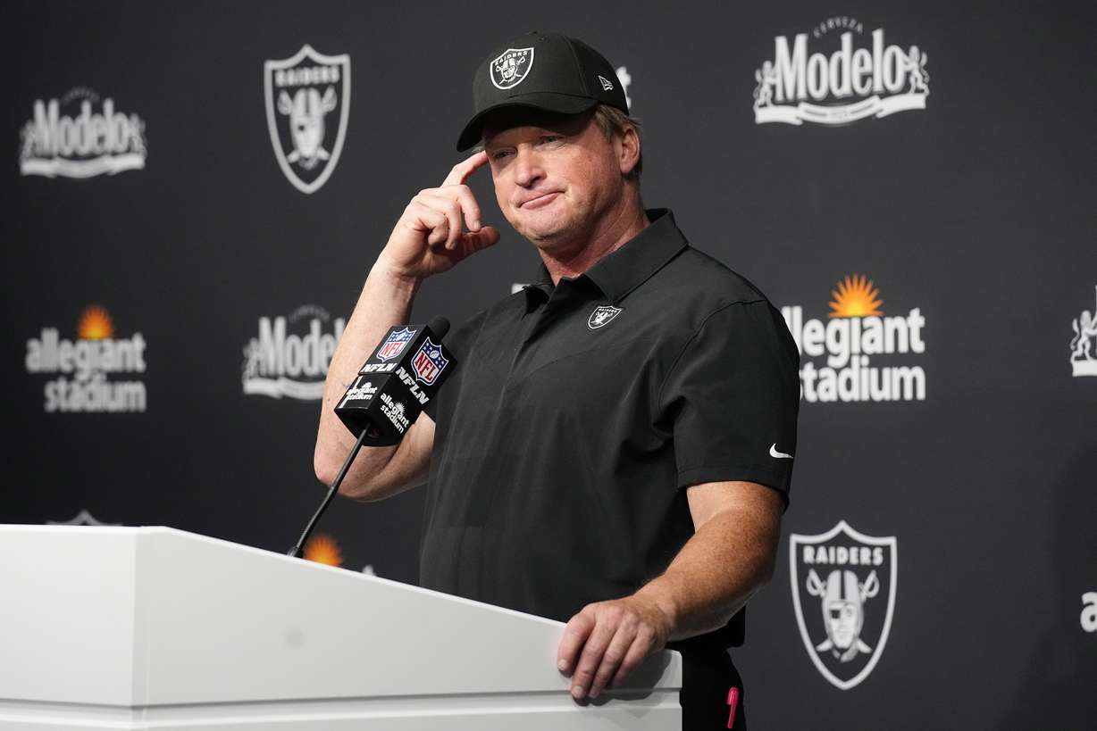 Las Vegas Raiders head coach Jon Gruden attends a news conference after an NFL football game against the Miami Dolphins in Las Vegas, in this Sunday, Sept. 26, 2021, file photo. Gruden is out as coach of the Las Vegas Raiders after emails he sent before being hired in 2018 contained racist, homophobic and misogynistic comments.