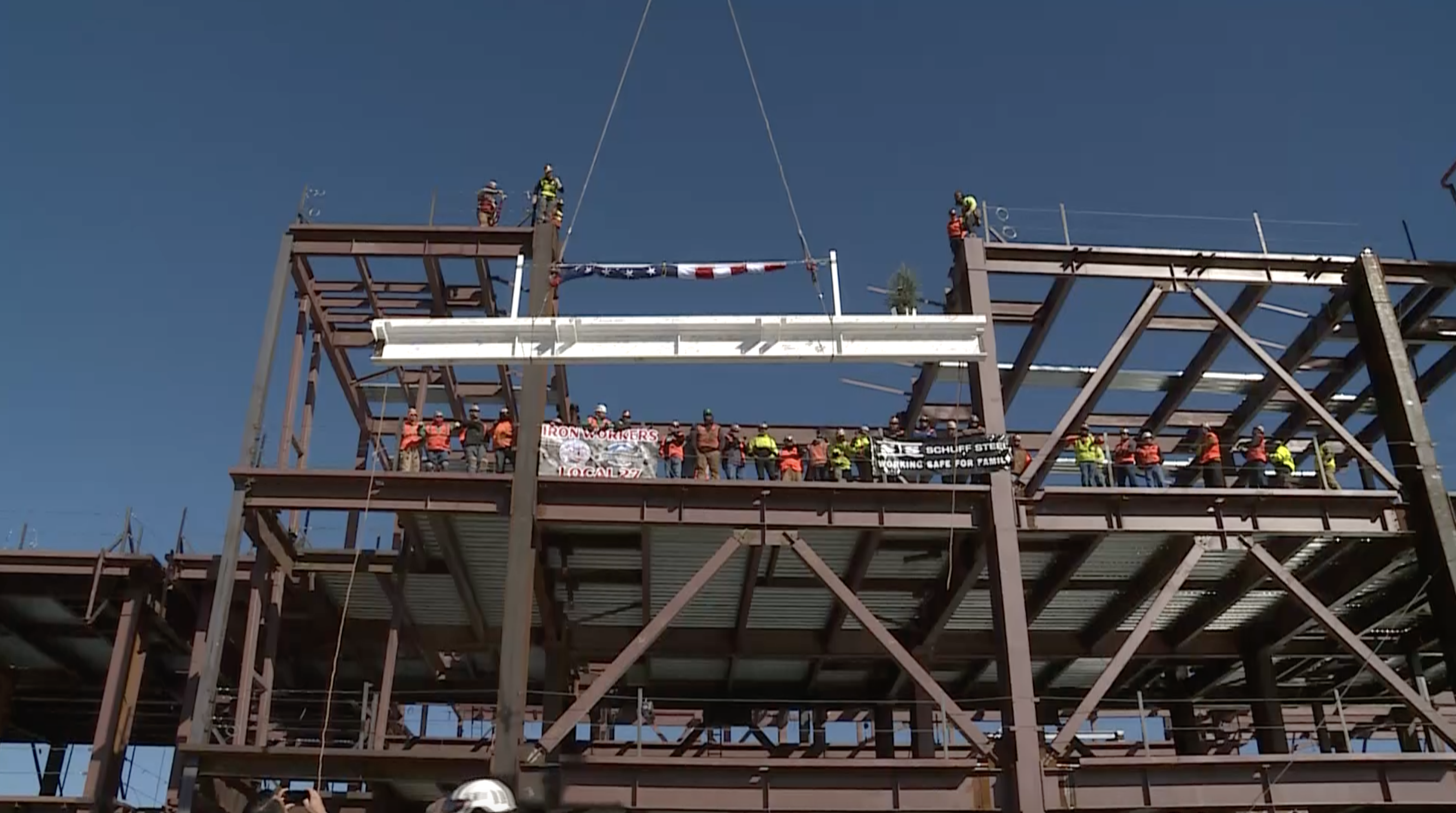 Workers hoisted a 3,500-pound steel beam to the top of the future east portion of concourse A at the Salt Lake City International Airport during a "topping out" ceremony celebrating a milestone in the next phase of the airport redevelopment on Wednesday, Oct. 13, 2021. 