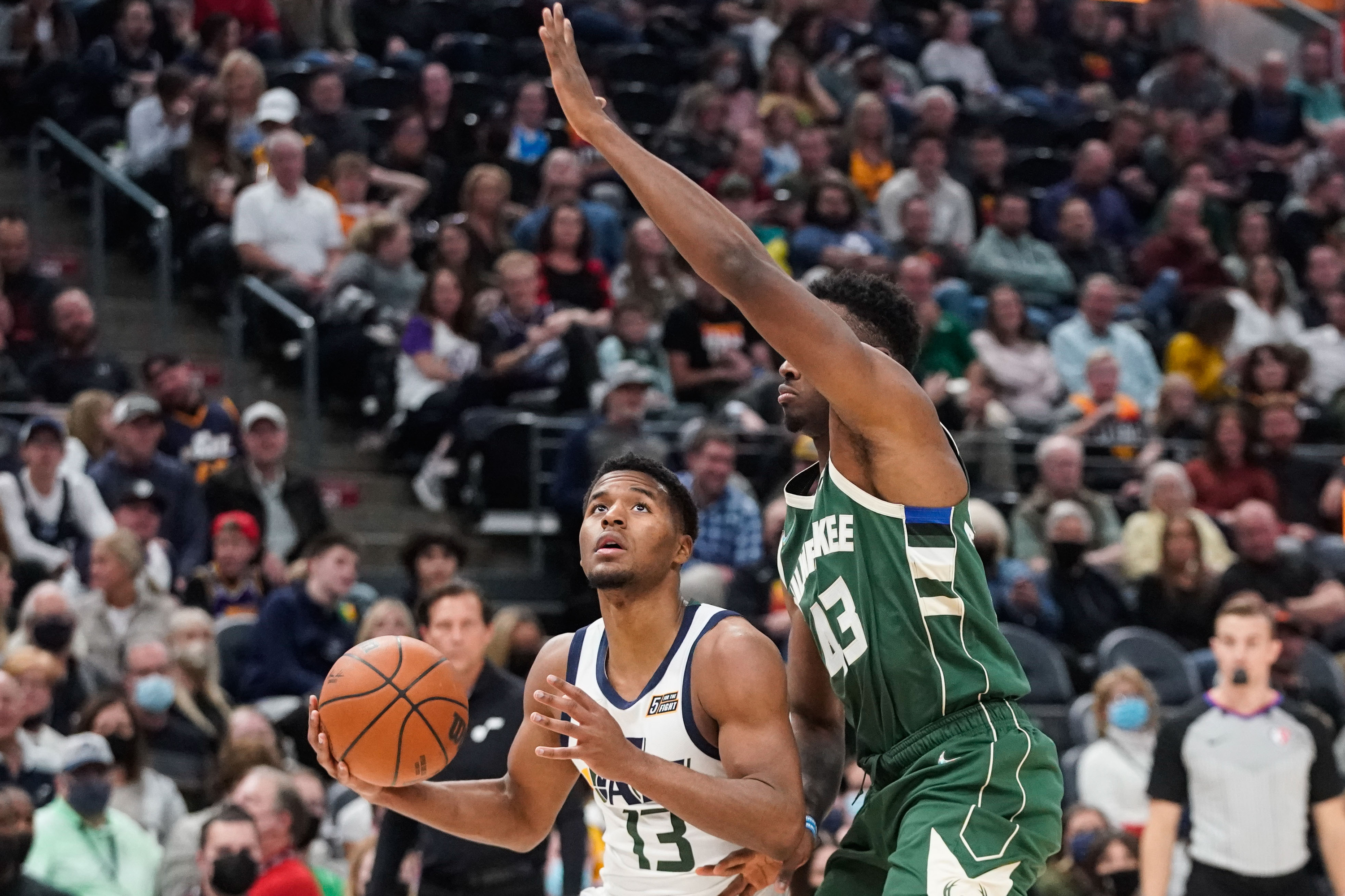 Utah Jazz guard and 2021 NBA draft second-round pick Jared Butler looks to shoot the ball as Milwaukee Bucks forward Thanasis Antetokounmpo tries to block during an NBA preseason game at Vivint Arena in Salt Lake City on Wednesday, Oct. 13, 2021.