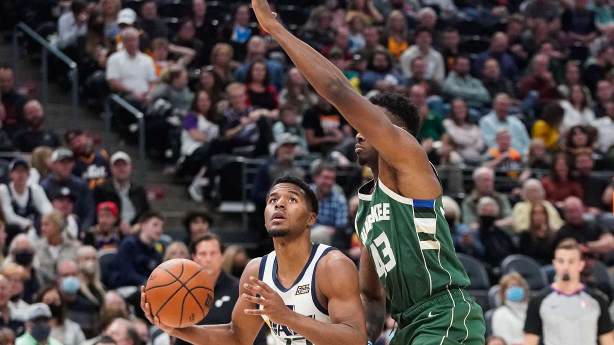 Utah Jazz guard and 2021 NBA draft second-round pick Jared Butler looks to shoot the ball as Milwaukee Bucks forward Thanasis Antetokounmpo tries to block during an NBA preseason game at Vivint Arena in Salt Lake City on Wednesday, Oct. 13, 2021.