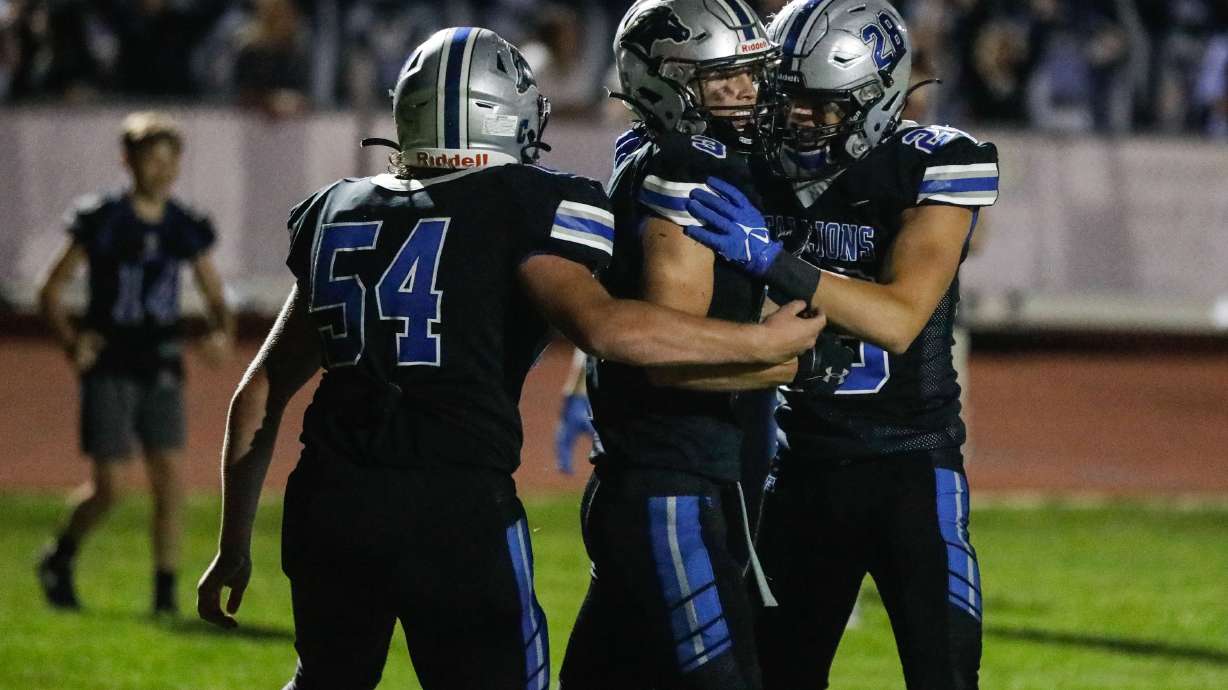Stansbury players celebrate a touchdown during a high school football game against Tooele at Stansbury High School in Stansbury Park on Friday, Sept. 17, 2021.
