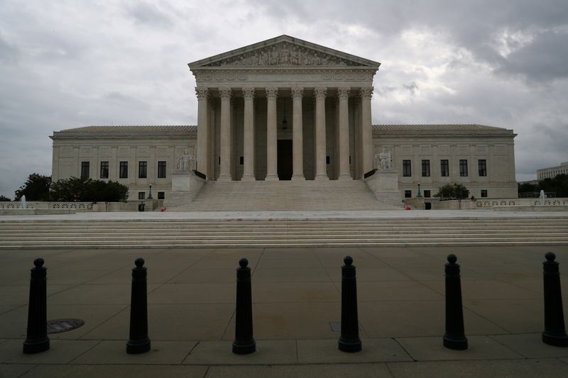 Storm clouds roll in over the U.S. Supreme Court, following an abortion ruling by the Texas legislature, in Washington, Sept. 1. A White House commission studying potential changes to the U.S. Supreme Court said expanding the number of justices would pose "considerable" risks and might further politicize the court, according to preliminary draft documents released on Thursday.