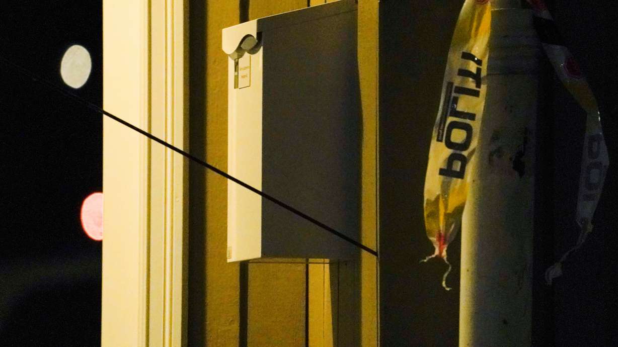 An arrow left in a wall is seen after several people were killed and others were injured by a man using a bow and arrows to carry out attacks in Kongsberg, Norway, Wednesday.