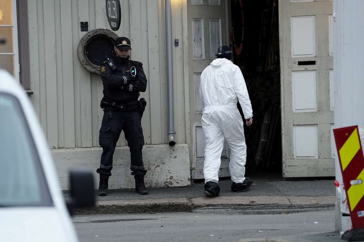 A police technician enters a building in the town center after a deadly attack in Kongsberg, Norway on Thursday.