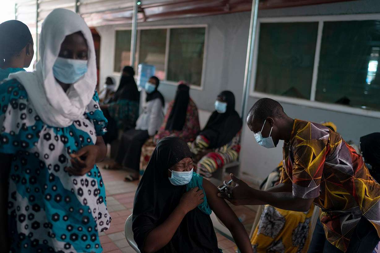 A health worker administers a dose of Janssen COVID-19 vaccine by Johnson & Johnson at the Bundung Maternal and Child Health Hospital in Serrekunda, outskirts of Banjul, Gambia, Thursday, Sept. 23, 2021.