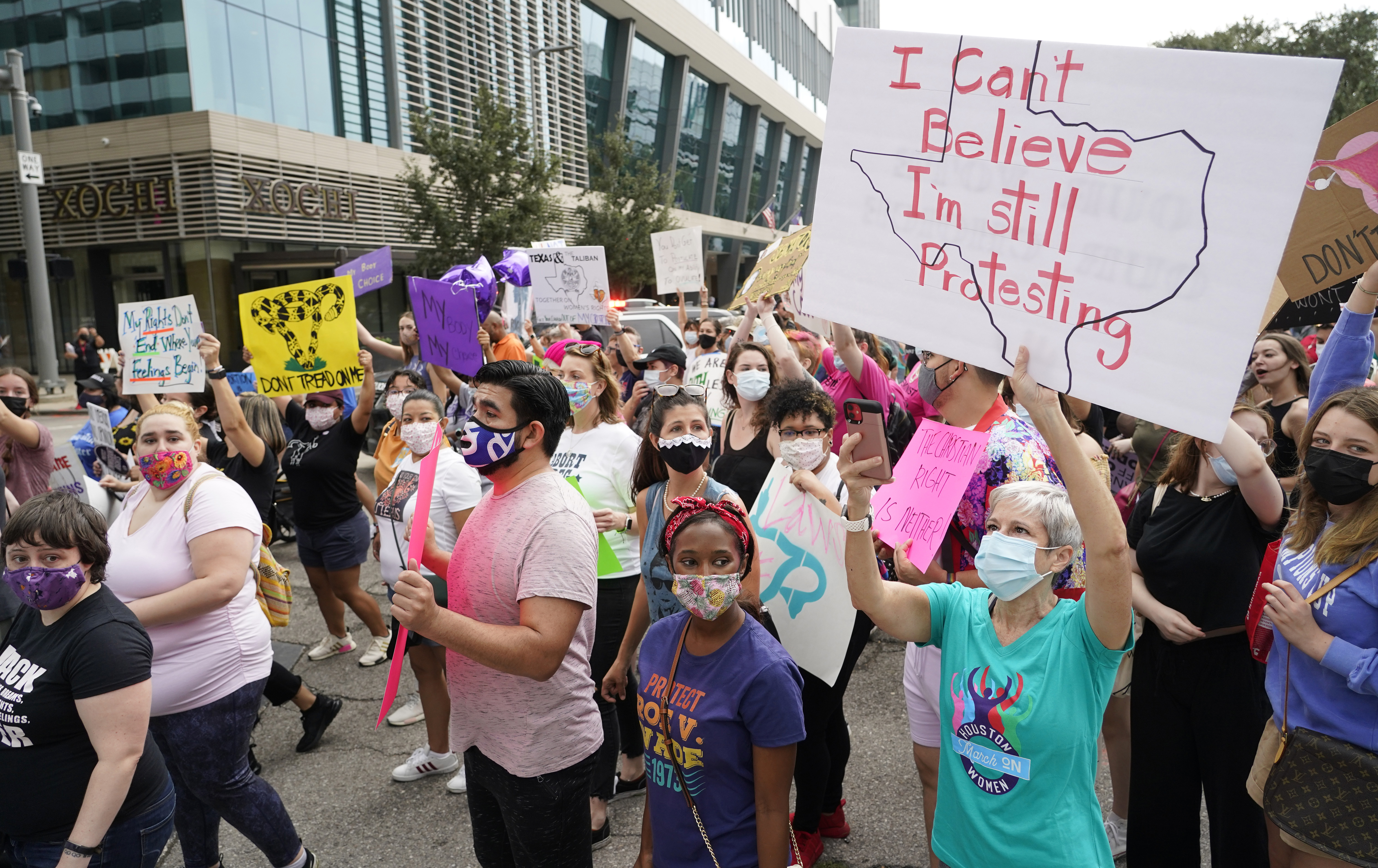 People participate in the Houston Women's March against Texas abortion ban walk from Discovery Green to City Hall in Houston on Oct. 2.  A federal appeals court is temporarily allowing the nation’s toughest abortion law to resume in Texas. The 5th U.S. Circuit Court of Appeals handed down the order Friday, Oct. 8.  