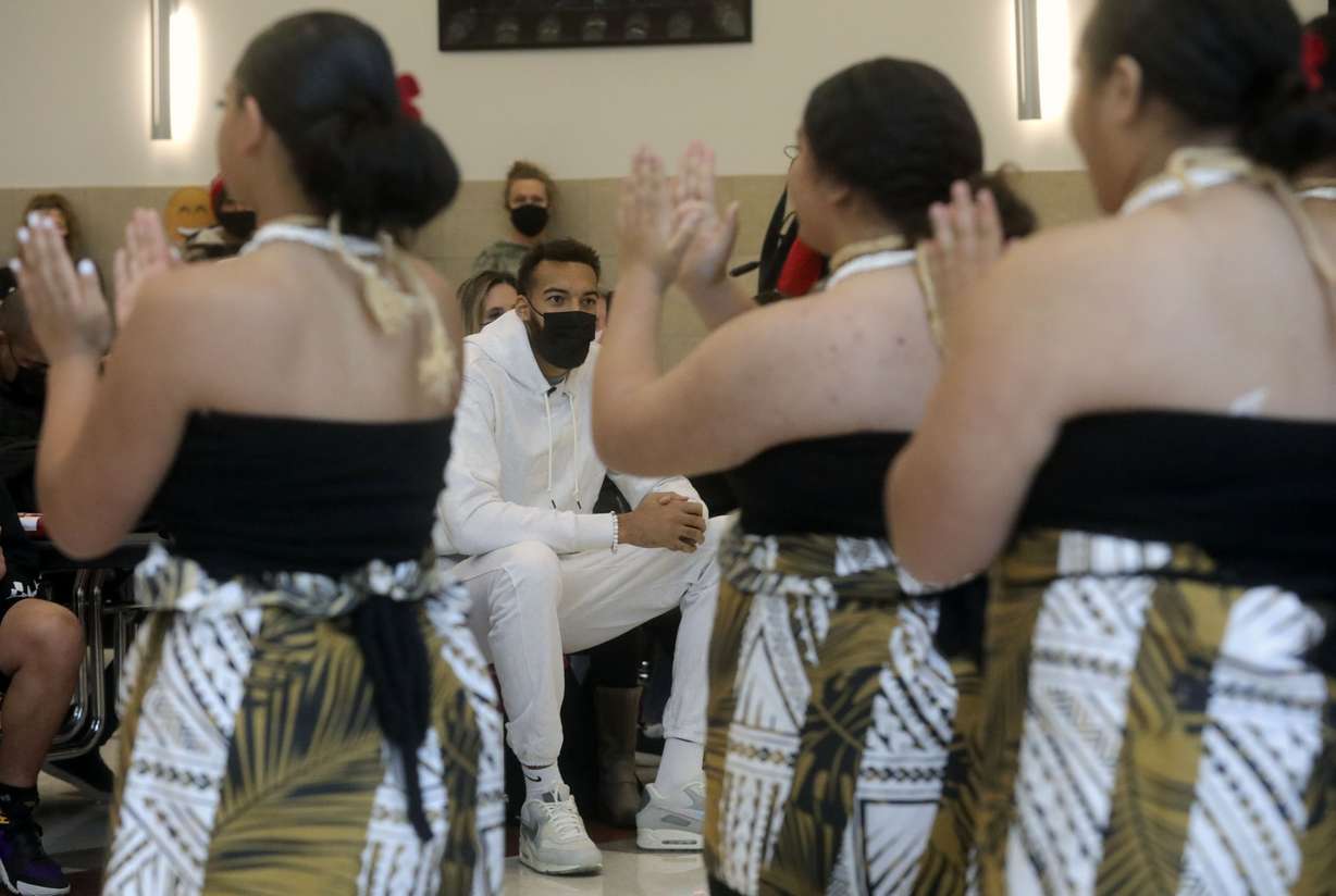 Rudy Gobert, Utah Jazz center and founder of Rudy’s Kids Foundation, center, watches the Northwest Multicultural Dancers perform a Fijian dance at a ribbon-cutting ceremony for the new emergency food pantry at Northwest Middle School in Salt Lake City on Thursday, Oct. 14, 2021.