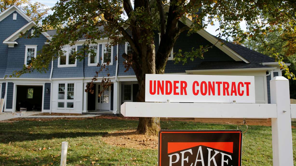 A real estate sign advertising a home "Under Contract" is pictured in Vienna, Virginia, outside of Washington, Oct. 20, 2014. Close to half a million low-income homeowners in the United States are nearing the end of mortgage forbearance plans that allowed them to halt loan payments during the pandemic.