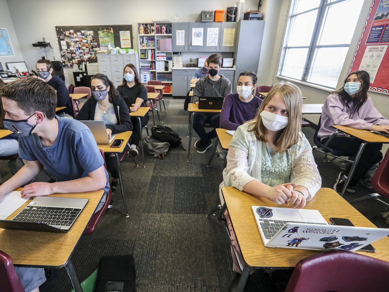 Students take notes in Mallory Record’s Advanced
Placement government and comparative politics class at Jordan High
School in Sandy on March 10. The latest results of
a survey of some 71,000 Utah schoolchildren suggests one third of
students reported the coronavirus pandemic made them feel anxious,
sad — even hopeless.