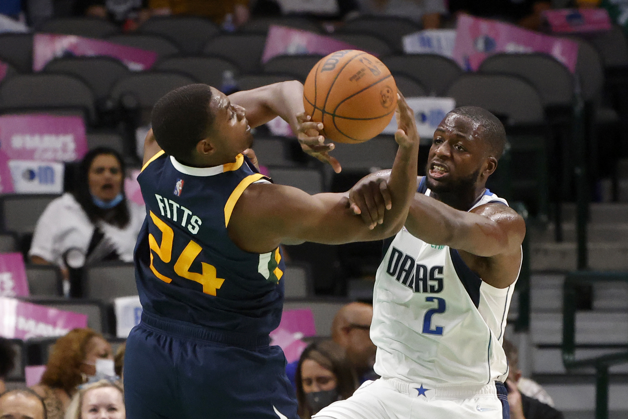 Utah Jazz forward Malik Fitts (24) and Dallas Mavericks forward Eugene Omoruyi (2) compete for the ball during the second half of an NBA preseason basketball game in Dallas, Wednesday, Oct. 6, 2021.


