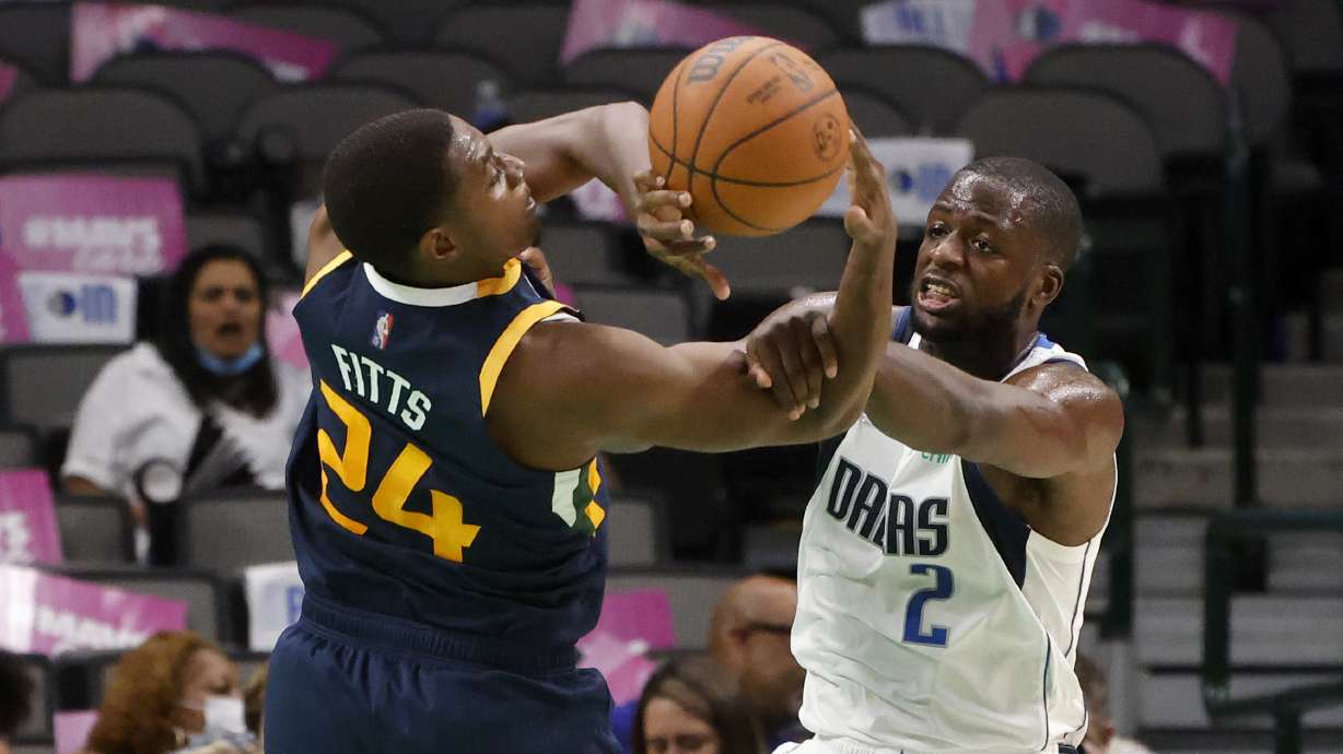 Utah Jazz forward Malik Fitts (24) and Dallas Mavericks forward Eugene Omoruyi (2) compete for the ball during the second half of an NBA preseason basketball game in Dallas, Wednesday, Oct. 6, 2021.