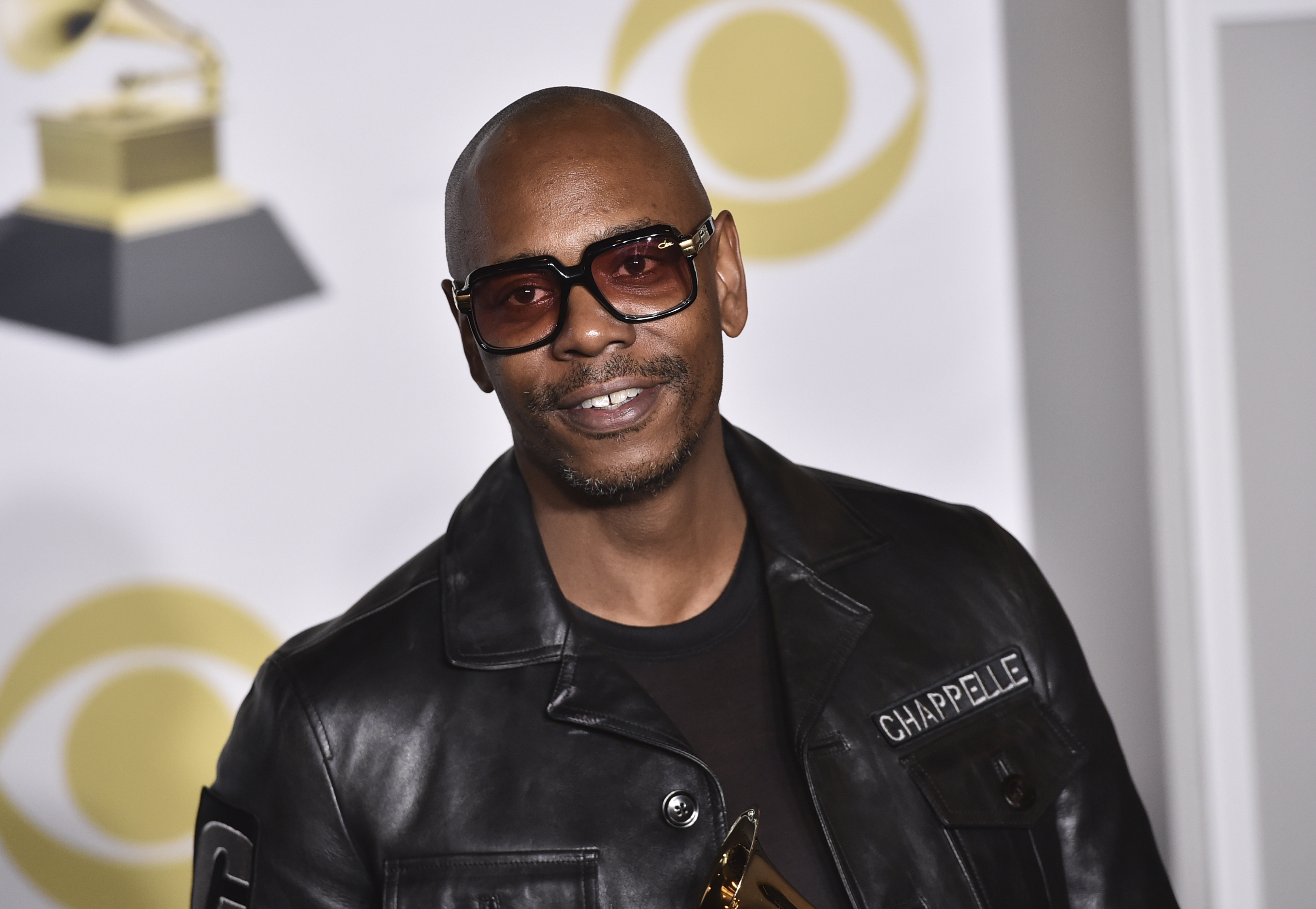 Dave Chappelle poses in the press room at the 60th annual Grammy Awards in New York. Netflix said Oct. 15, 2021 that it had fired an employee for disclosing confidential financial information about what it paid for Dave Chappelle’s comedy special “The Closer," which some condemned as being transphobic.
