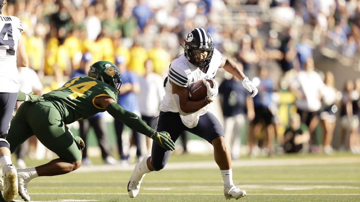 BYU running back Tyler Allgeier runs against Baylor during the Cougars' road game at Baylor, Saturday, Oct. 16, 2021 at McLane Stadium in Waco, Texas.