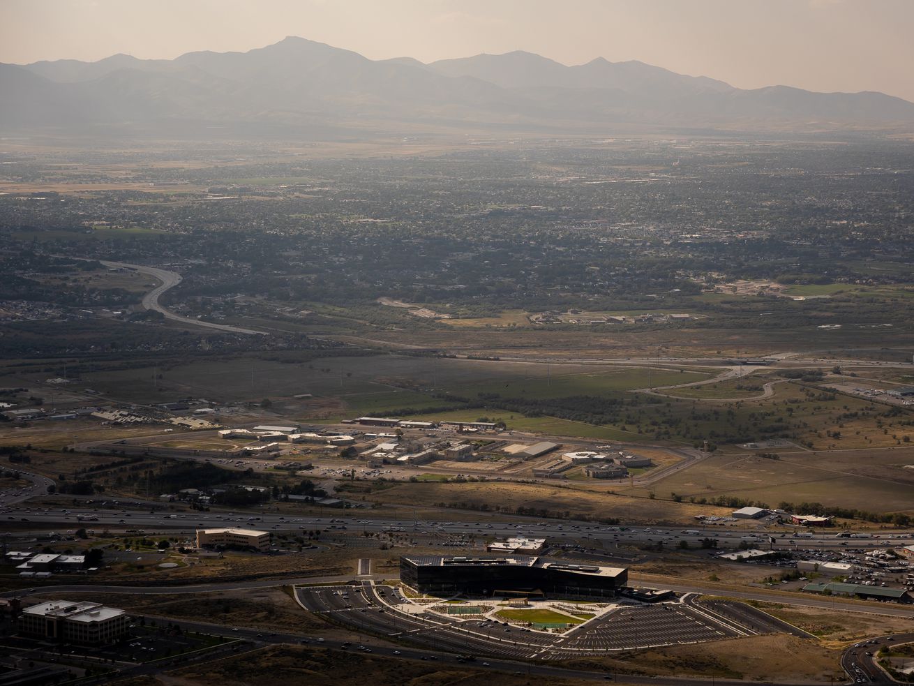 The Utah State Prison, the headquarters of tech company Pluralsight and I-15 in Draper are pictured on Aug. 25. Once the prison relocates to its new site near the airport, the land will be redeveloped into The Point — a master planned "complete community.”
