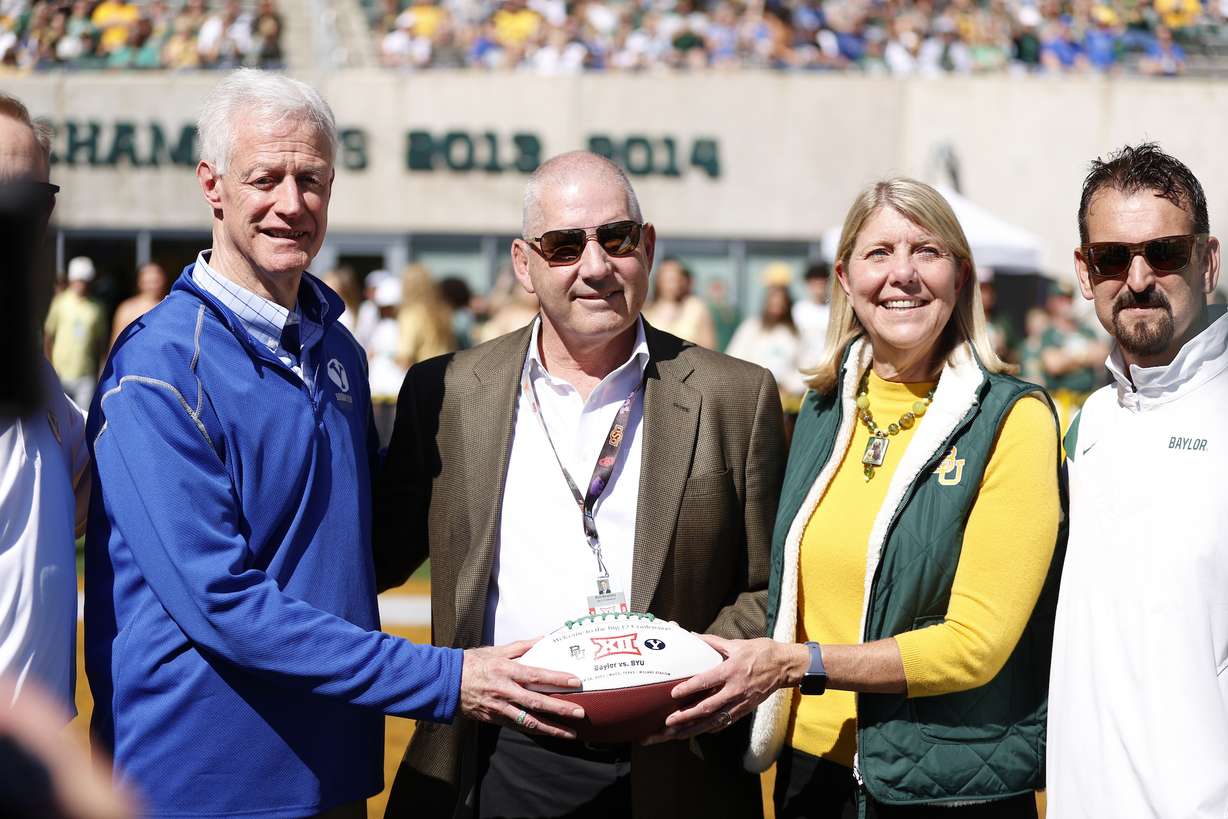 BYU president Kevin J. Worthen, left, right Big 12 commissioner Bob Bowlsby and Baylor president Linda Livingstone during the Cougars' NCAA football game, Saturday, Oct. 16, 2021 in Waco, Texas.