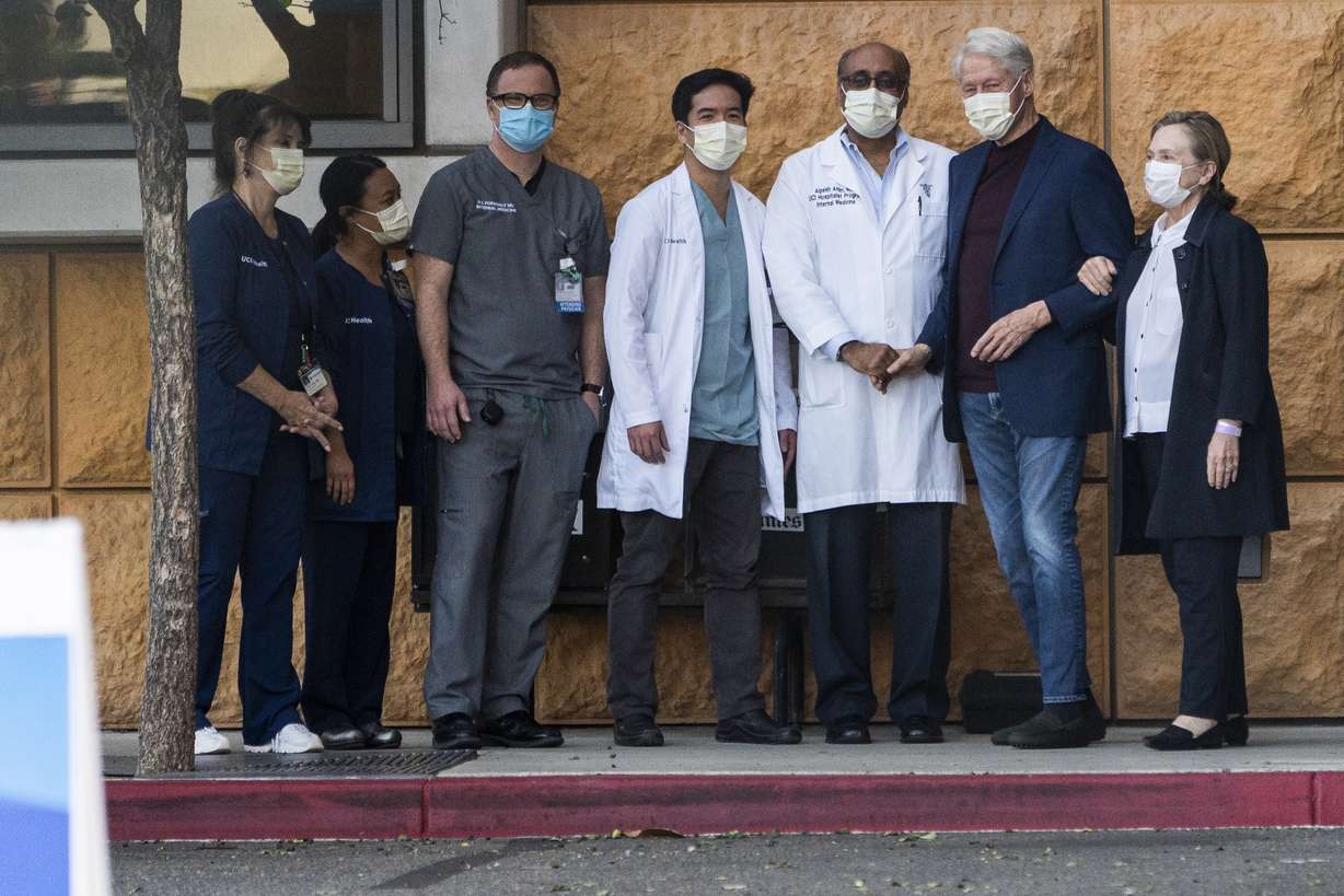 Former President Bill Clinton, and former first lady and former U.S. Secretary of State Hillary Clinton thank Alpesh N. Amin, MD, third from left, and the medical staff as he is released from the University of California Irvine Medical Center in Orange, Calif., Sunday.
