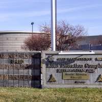 Man swinging hatchet used wheelchair to bulldoze into estranged wife's apartment, police say