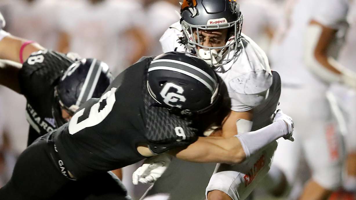 Corner Canyon’s Harrison Taggart brings down Skyridge’s Jeter Fenton during a high school football game at Corner Canyon in Draper on Friday, Sept. 24, 2021. Corner Canyon won 38-23.