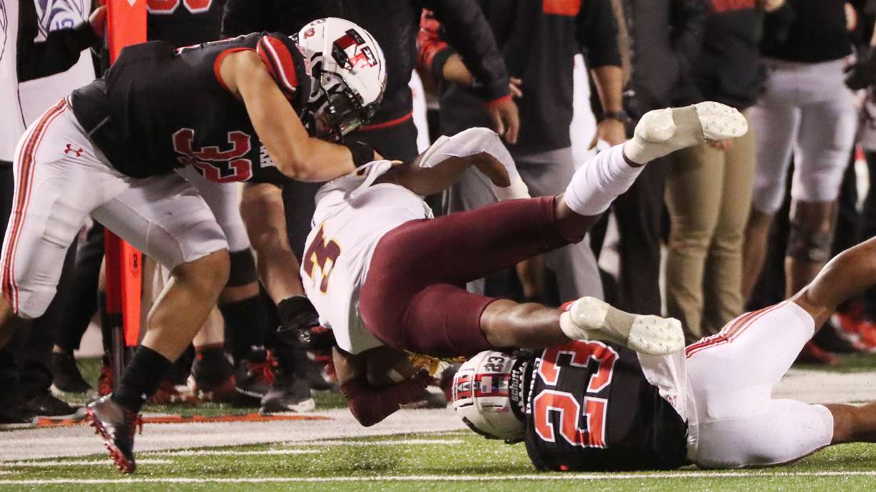 Arizona State Sun Devils running back Rachaad White (3) is tackled by Utah Utes cornerback Faybian Marks (23) and Utah Utes linebacker Karene Reid (32) in Salt Lake City on Saturday, Oct. 16, 2021. Utah won 35-21.