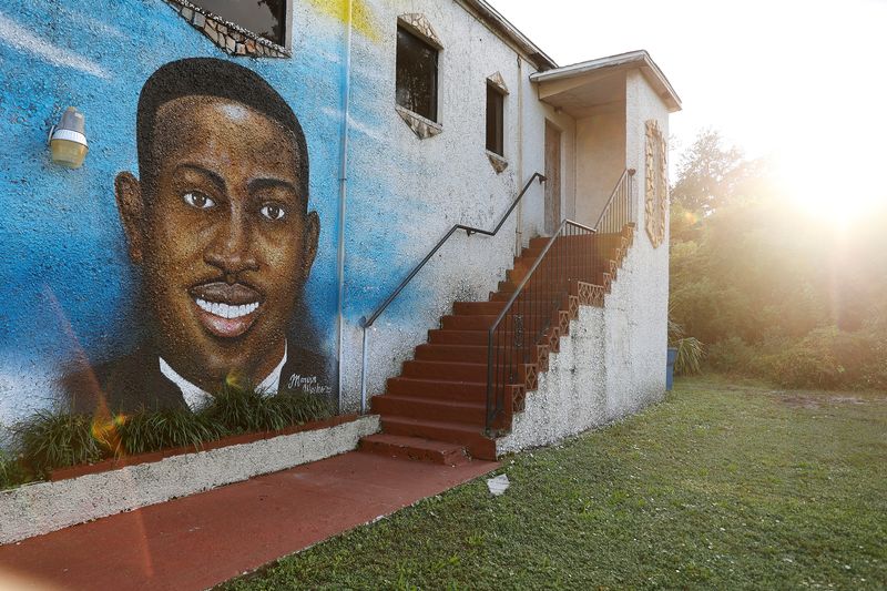 A mural of Ahmaud Arbery is painted on the side of The Brunswick African American Cultural Center in downtown Brunswick, Georgia, Oct. 11, 2021.