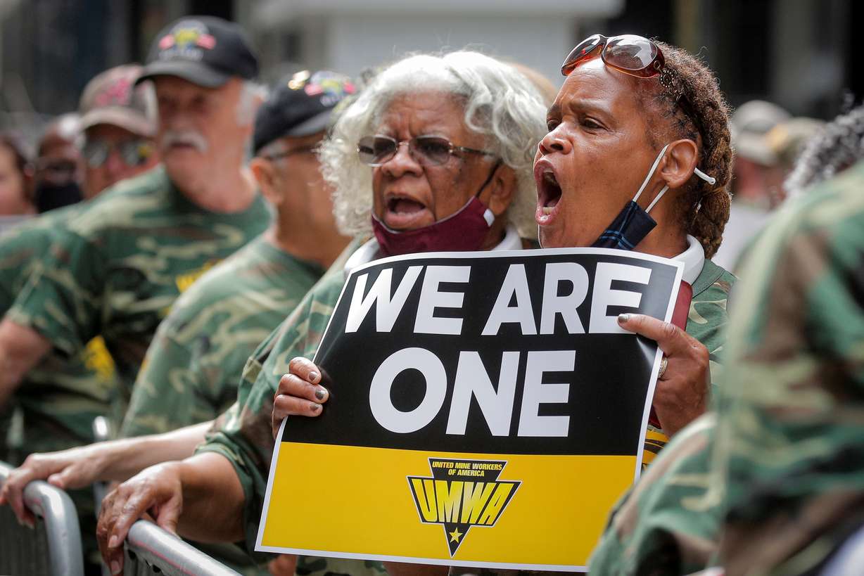 Members of United Mine Workers of America and other labor leaders picket about the union's strike at Warrior Met Coal Mine, outside BlackRock's Headquarters in New York City, July 28.