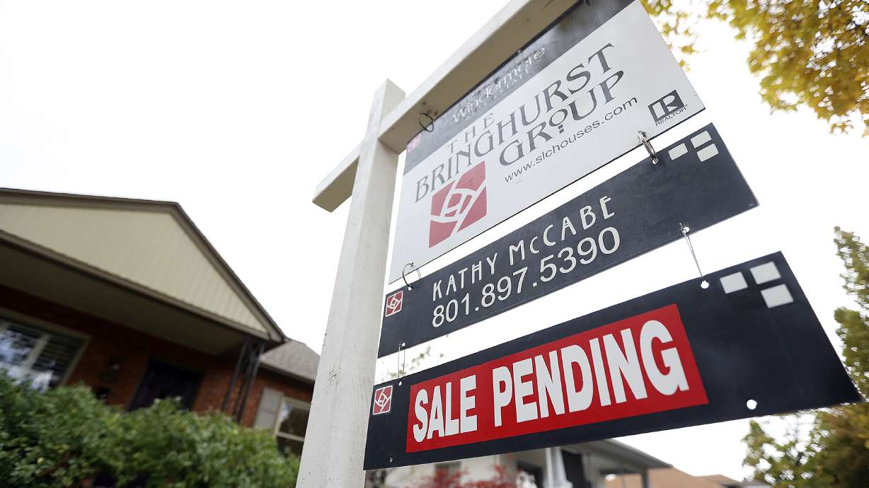 A “for sale” sign and “sale pending” sign are pictured in Salt Lake City on Oct. 18, 2021. The results of a Salt Lake City Council-commissioned survey on gentrification are in, showing a high majority of residents are troubled about how their city is changing.