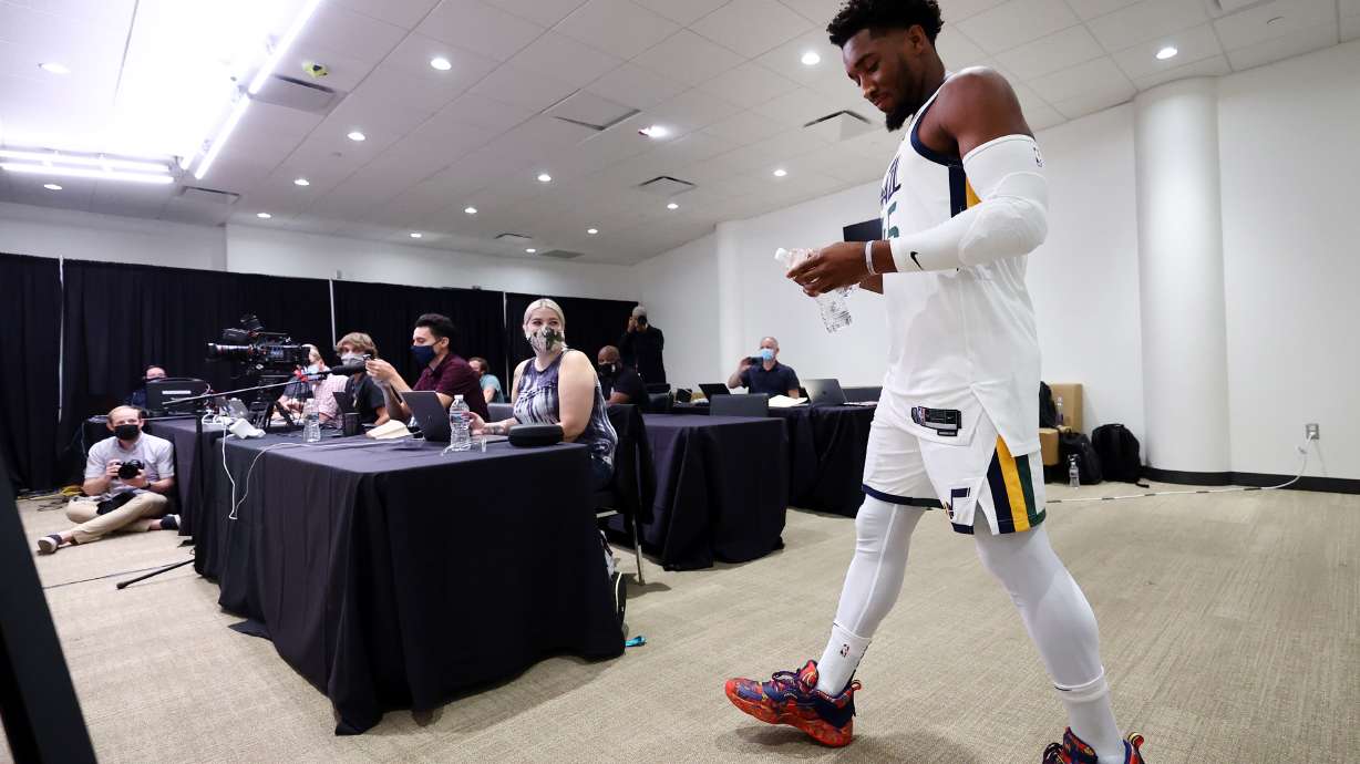 Utah Jazz guard Donovan Mitchell (45) walks in for an interview during the Utah Jazz media media day at Vivint Arena in Salt Lake City on Monday, Sept. 27, 2021.