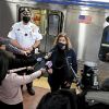 Train riders held up phones as woman was raped, police say
