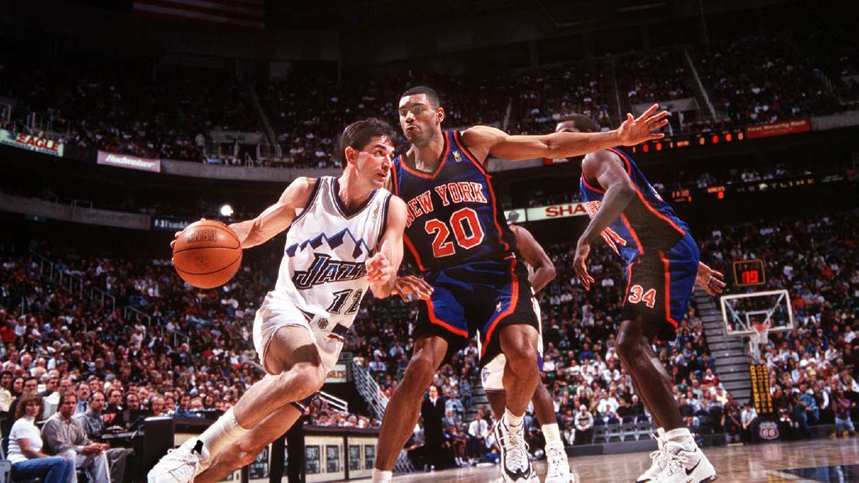 John Stockton drives to the basket against Philadelphia 76ers, 1996-97.