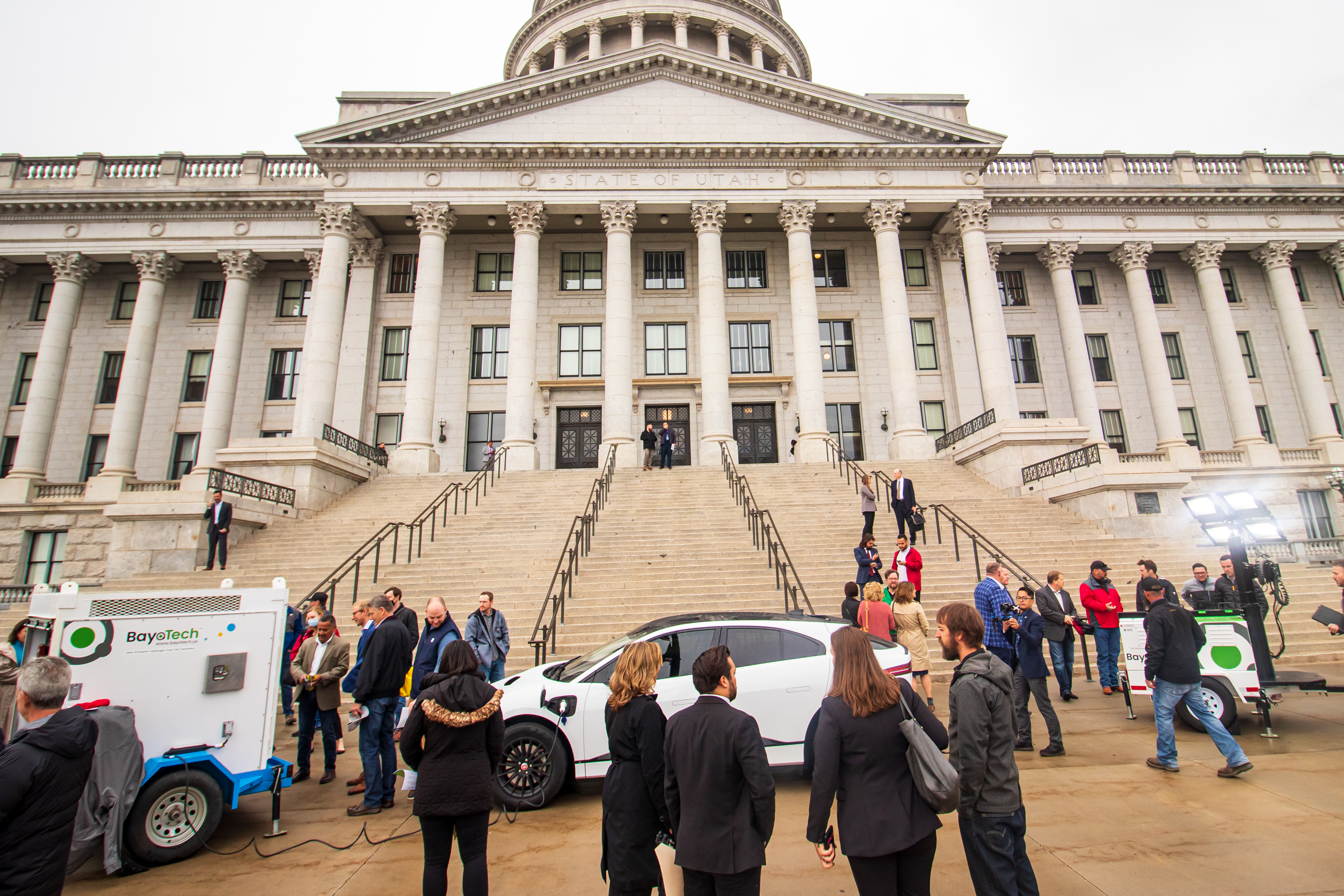 Attendees of an event highlighting the future of the alternative fuel check out a display of renewable natural gas, hydrogen and electric vehicles Tuesday.