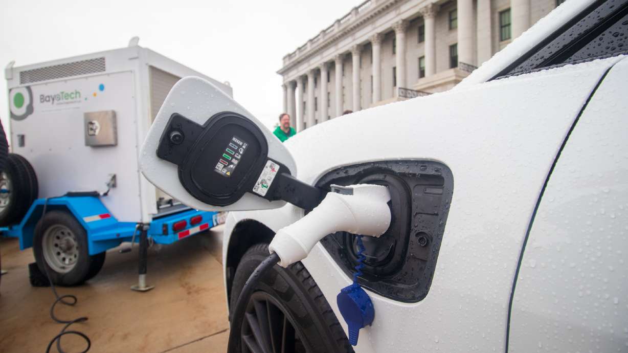 An electric vehicle is charged by a hydrogen power generator during an event outside of the state Capitol on Oct. 19, 2021. Utah joined three other states Thursday in a plan to create a Western Inter-State Hydrogen Hub.