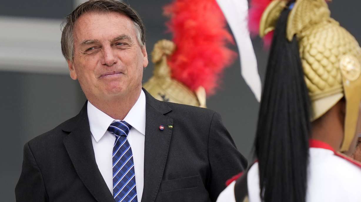 Brazilian President Jair Bolsonaro waits for the arrival of Colombia's President Ivan Duque to Planalto presidential palace in Brasilia, Brazil, Tuesday. A Brazilian senator has formally presented a report recommending Bolsonaro be indicted on criminal charges for allegedly bungling Brazil's response to the COVID-19 pandemic.