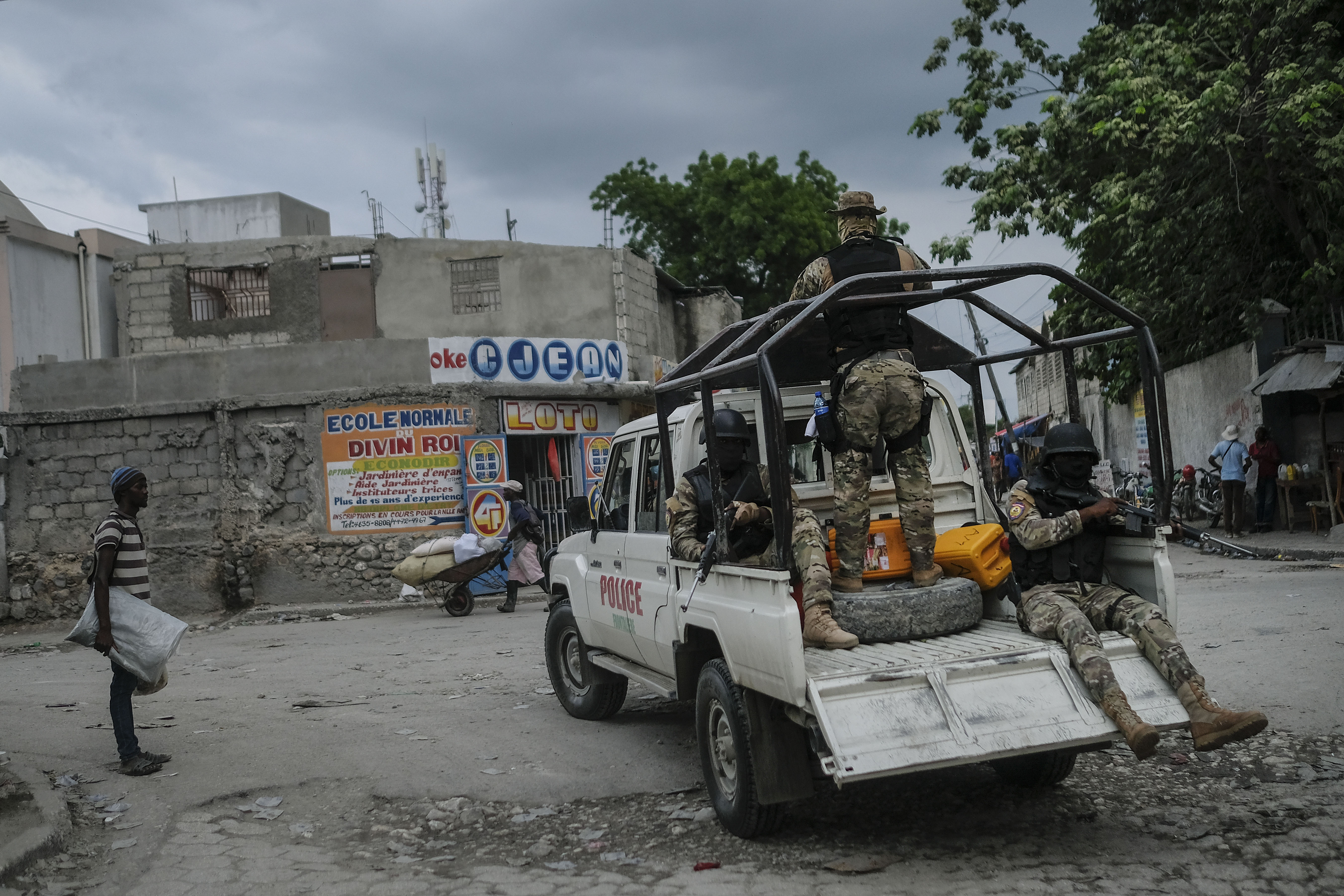 Security forces patrol the streets of Croix-des-Bouquets, near Port-au-Prince, Haiti, Tuesday. A general strike continues in Haiti demanding that authorities address the nation’s lack of security, four days after 17 members of a U.S.-based missionary group were abducted by a gang. 