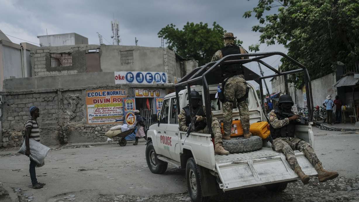 Security forces patrol the streets of Croix-des-Bouquets, near Port-au-Prince, Haiti, Tuesday. A general strike continues in Haiti demanding that authorities address the nation’s lack of security, four days after 17 members of a U.S.-based missionary group were abducted by a gang.