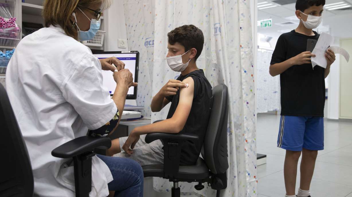 A youth receives a Pfizer-BioNTech COVID-19 vaccine in Israel June 6. U.S. children age 5 to 11 will soon be able to get a COVID-19 shot at their pediatrician's office, local pharmacy and potentially even their school, the White House said Wednesday.