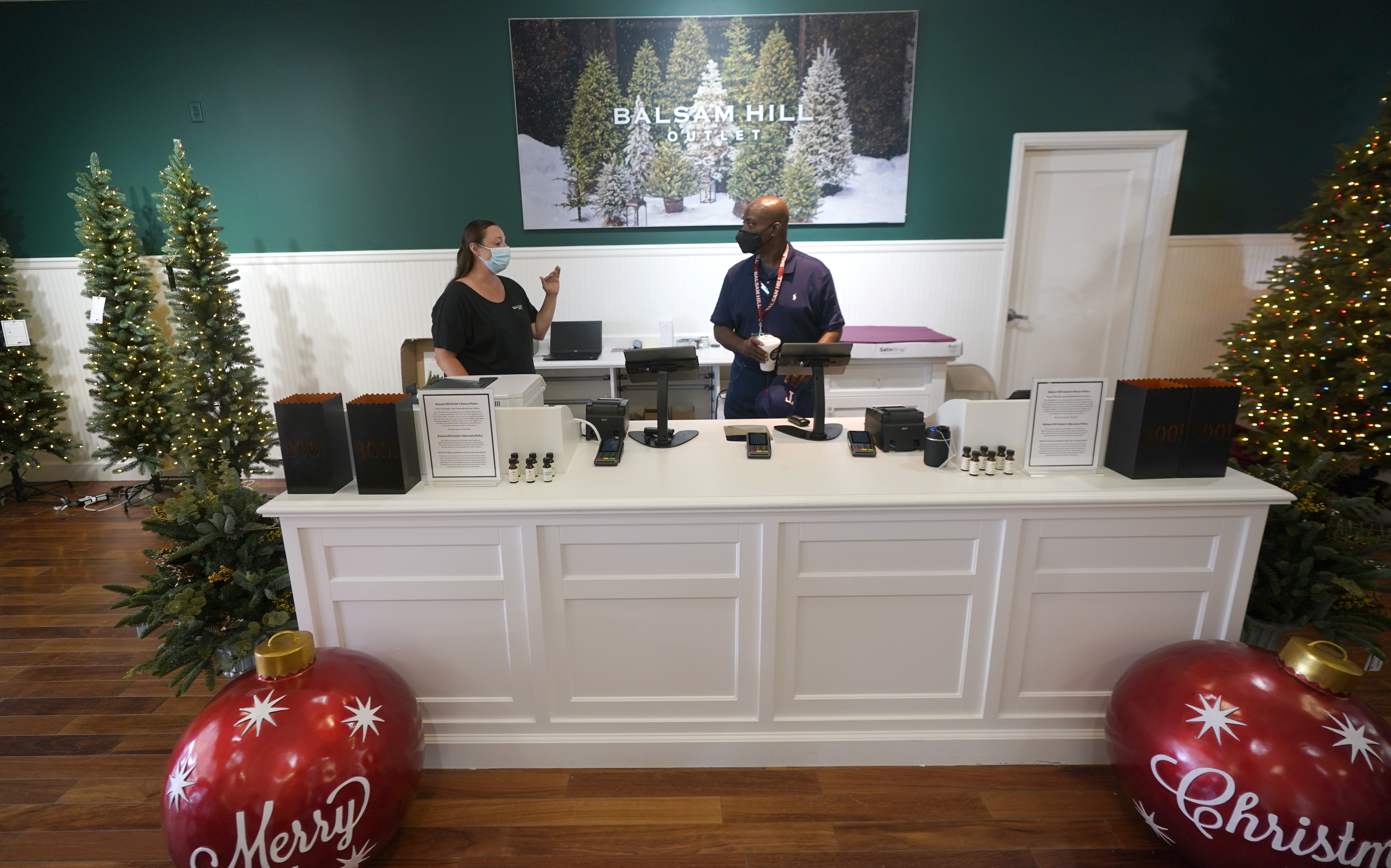 Balsam Hill Outlet sales associate Rickey Haynes, right, listens to manager Kelly Bratt during training in Allen, Texas, Monday, Sept. 20. Retailers, restaurants and others are grappling with increasing demands in the last few months from hourly workers for more flexible schedules, going beyond a better salary and bonuses. 