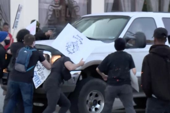 A man drives an SUV through a Black Lives Matter protest in Provo on June 19, 2020. The attorney for Jesse Taggart, who is charged with shooting a man in this vehicle, claimed Tuesday that the charges should be dismissed because police did not take sufficient evidence from the vehicle at the time.