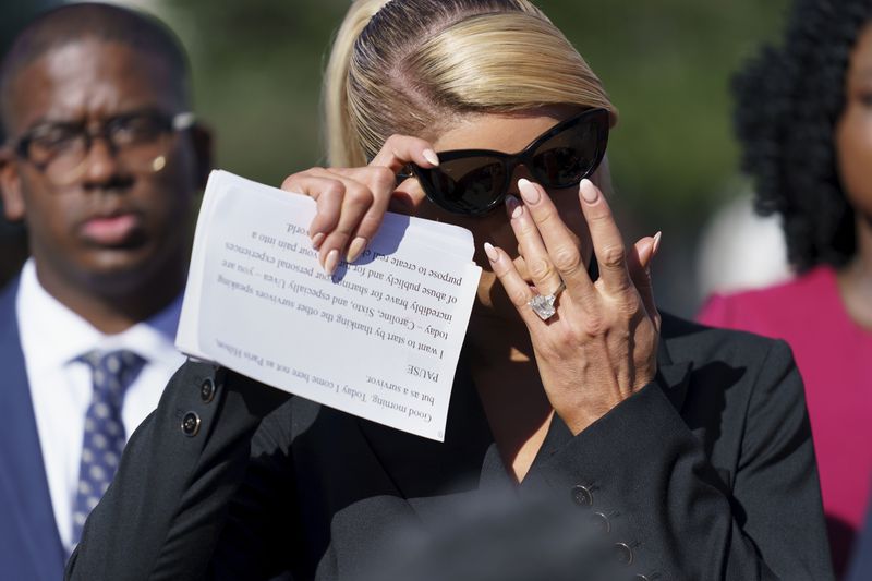 Hotel heiress and reality television star Paris Hilton,
lends her celebrity to support legislation to establish a bill of
rights for children placed in congregate care facilities, at the
Capitol on Wednesday. Hilton says she was
traumatized as a teenager when she was sent by her family to
abusive care facilities.