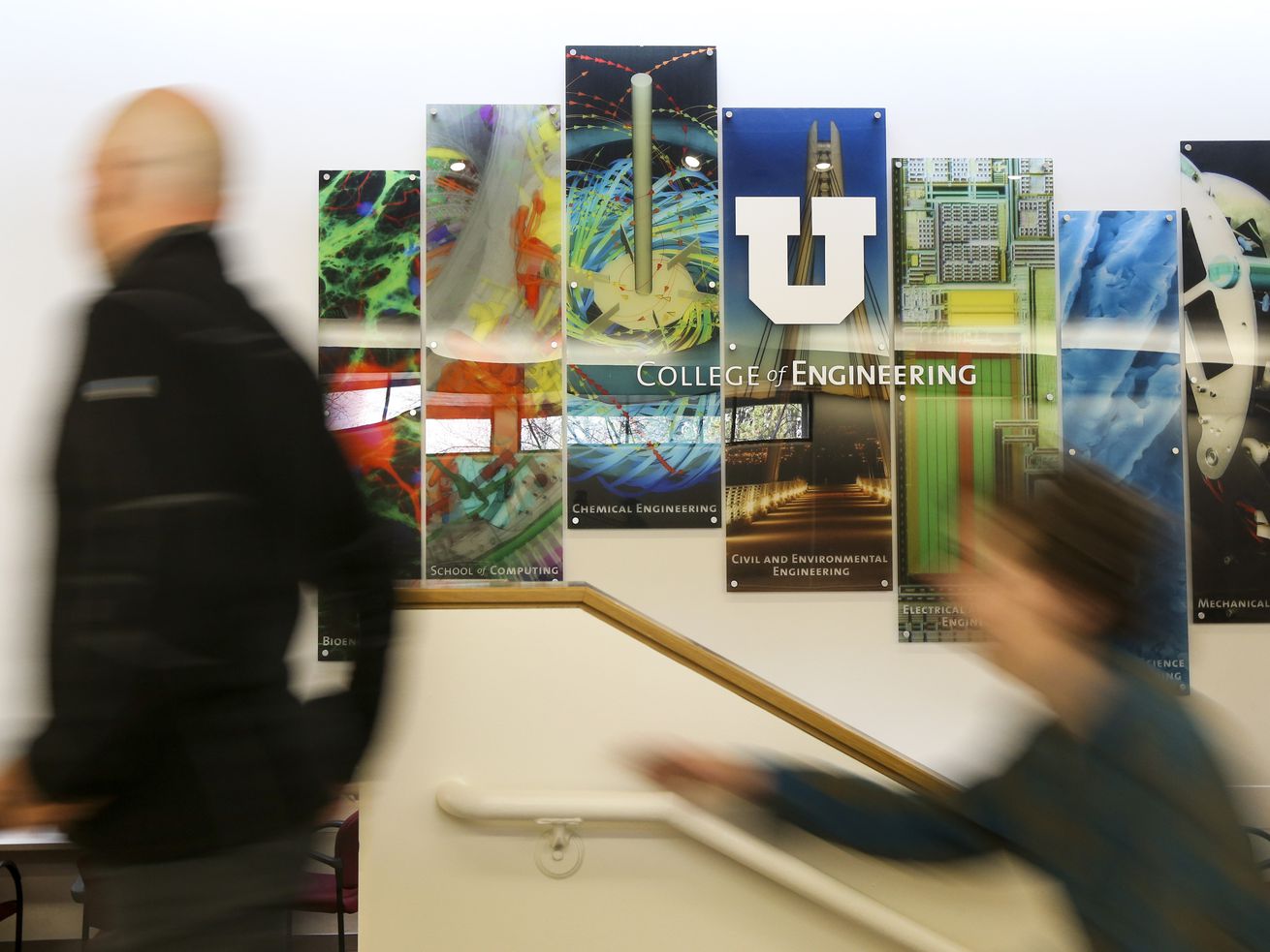 A father and son walk past a College of
Engineering at the University of Utah sign during the
university’s annual Engineering Day event on campus in Salt Lake
City, Nov. 23, 2019.
