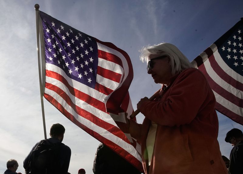 Protesters hold U.S flags during a rally calling for a
forensic vote audit at the Capitol in Salt Lake City on Wednesday.