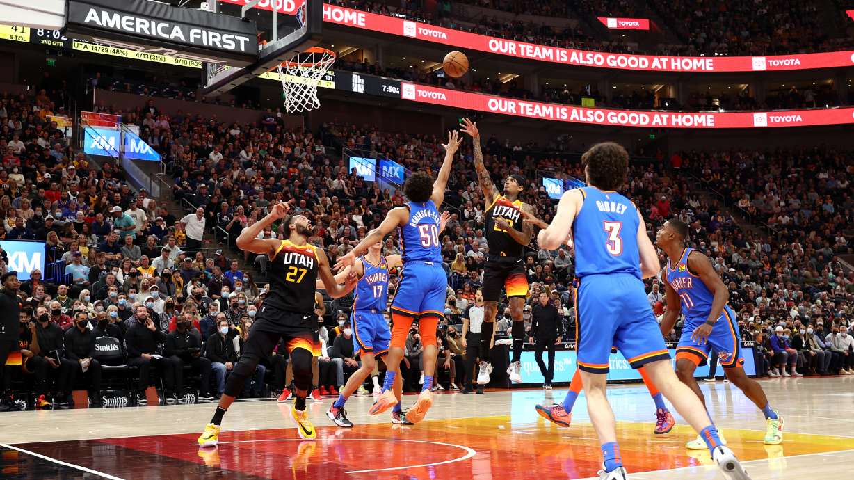 Utah Jazz guard Jordan Clarkson (00) floats up a shot over Oklahoma City Thunder forward Jeremiah Robinson-Earl (50) as the Utah Jazz and the Oklahoma City Thunder open the 2021-22 season at Vivint Arena in Salt Lake City on Wednesday, Oct. 20, 2021.