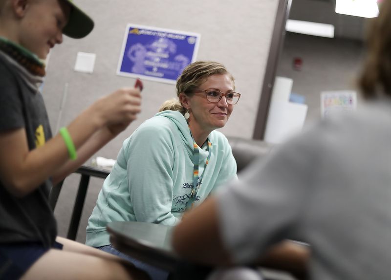 Christina Sharp, a refocus coordinator, plays a game
called You Know with fourth graders Andrew and Paxton at Pahvant
Elementary School in Richfield on Sept. 29.